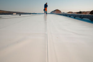 roofers from 1 By 1 roof work to maintain a flat roof